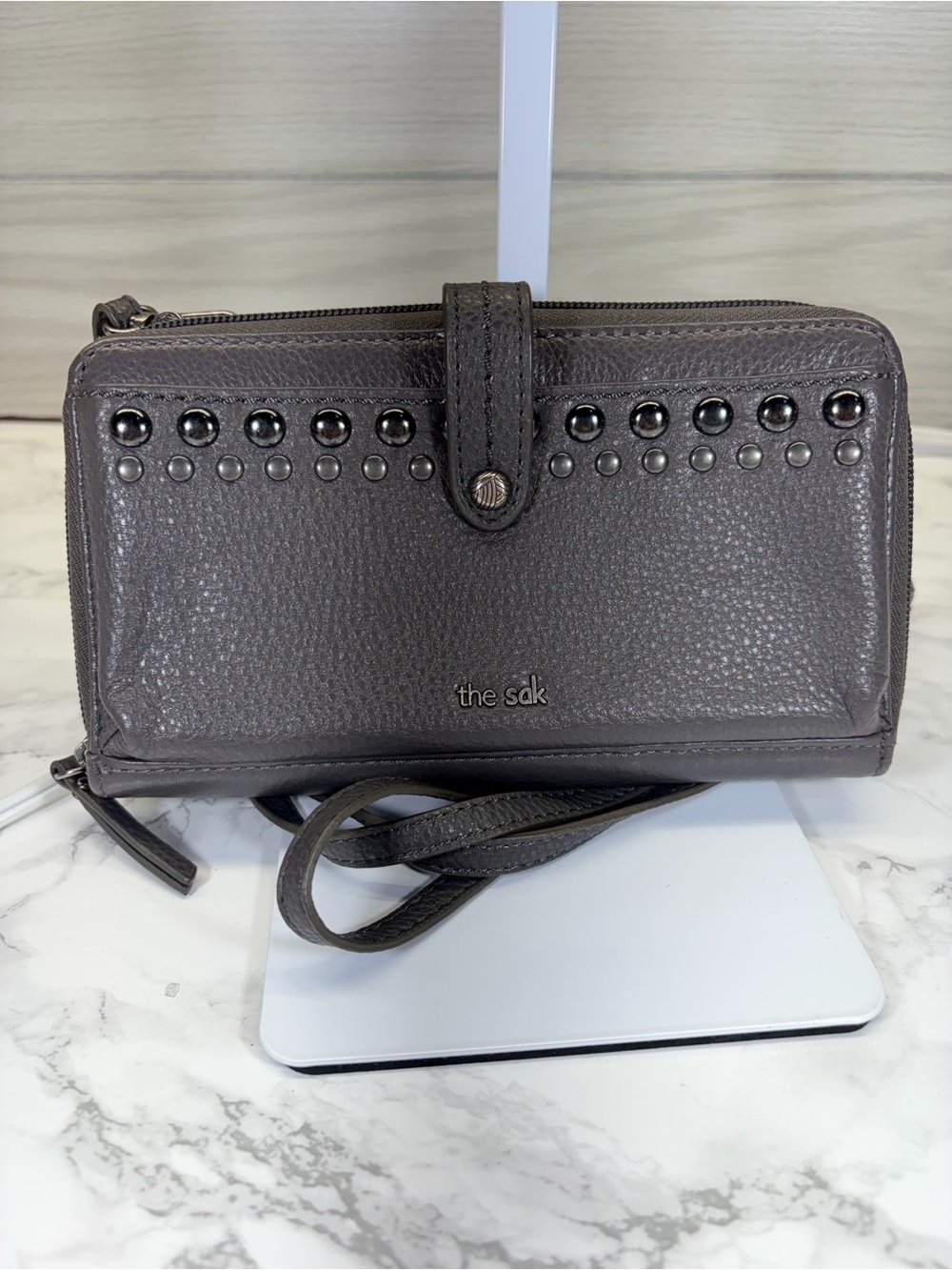 The Sak Grey Pebbled Leather Crossbody Wallet with Stud Accents